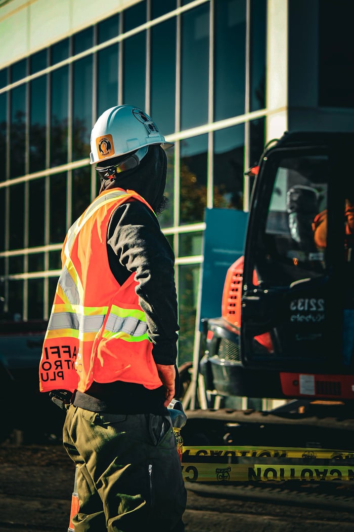 Home Construction worker in safety gear at an urban site in Ontario, Canada.